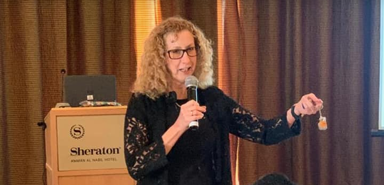 Julie speaking at a leadership forum in Jordan
